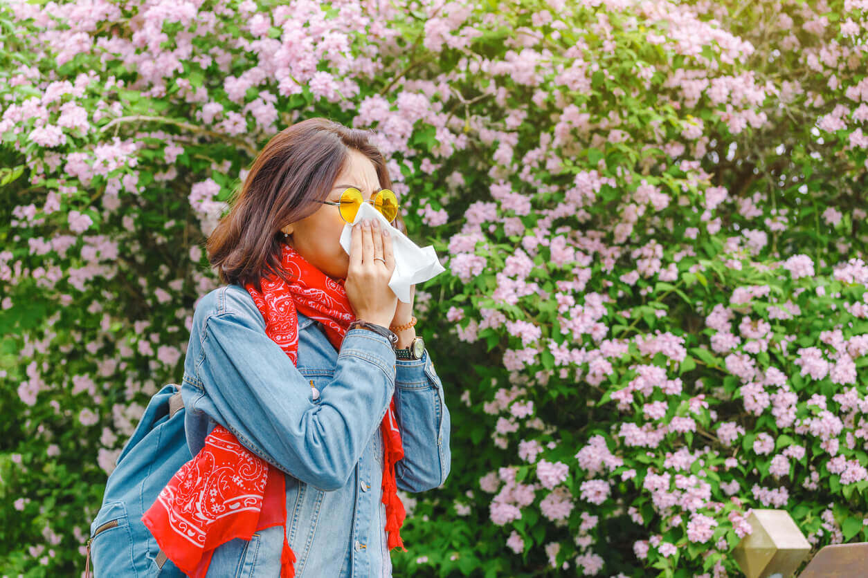 woman blowing her nose 